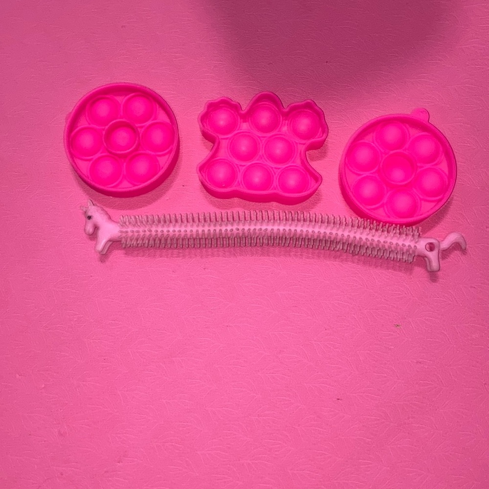 4PCS. Pop it Bundle of 3 small pink fidgets and a unicorn monkey noodle